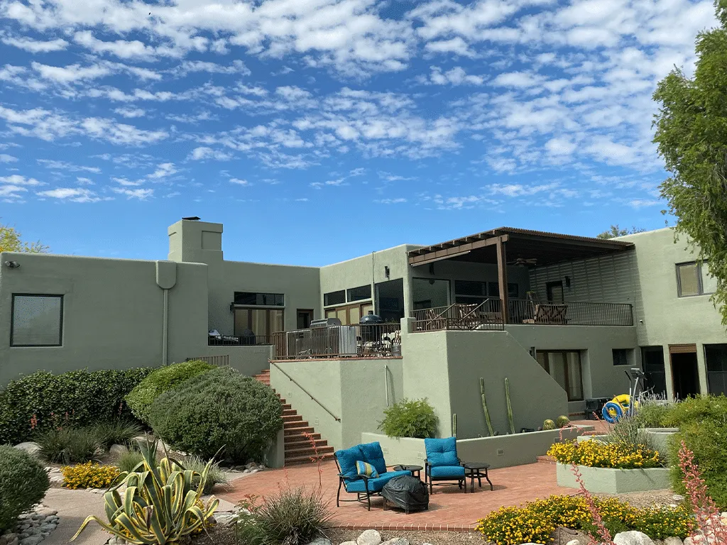 Two-story Tucson home with a fresh sage green exterior paint job