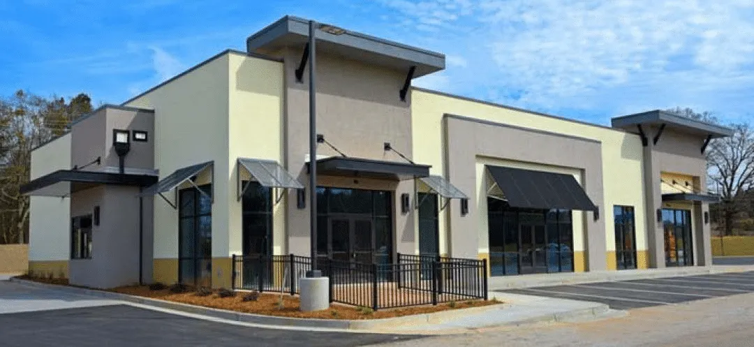 Freshly painted tan and brown commercial retail building in Tucson