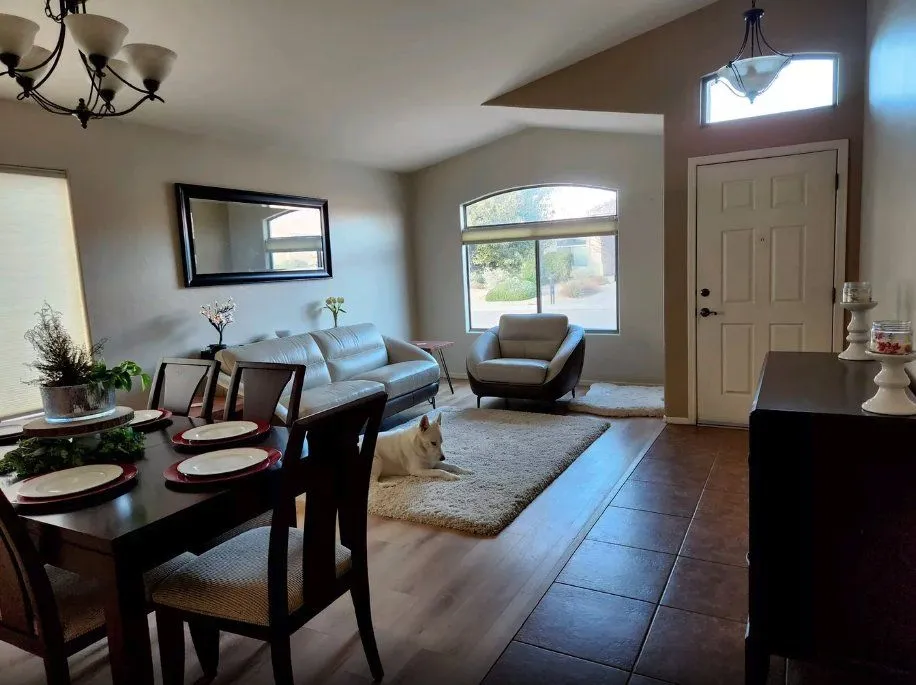 Dining and living area with newly painted walls and trim