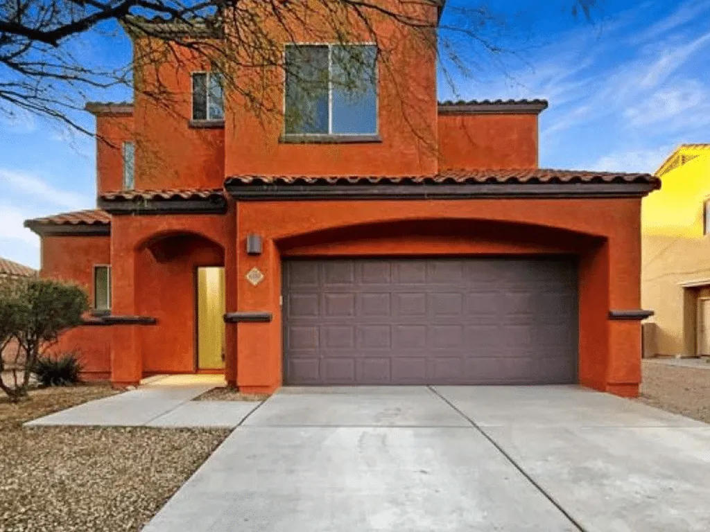 Two-story Tucson home painted in a warm sienna exterior color